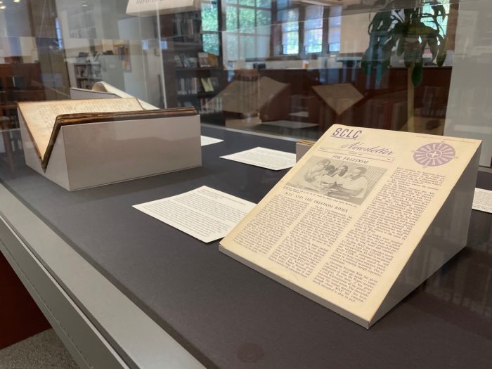 new exhibit featuring four books in a glass case -- in the front is an issue of the Southern Christian Leadership Conference newsletter