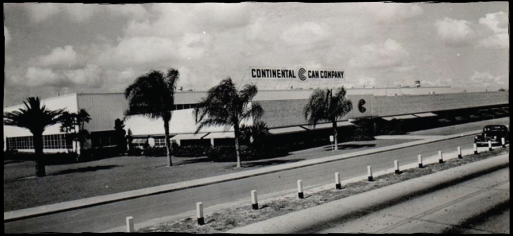 continental can company factory shot of lonf building with palm trees in front