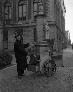 Peanut John with his cart outside campus gates.